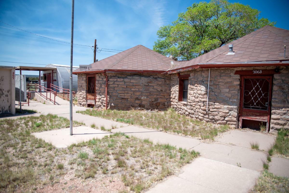 Historic school office built in 1935, showcasing a brick roof and a modest yard, covering 1078 square feet.