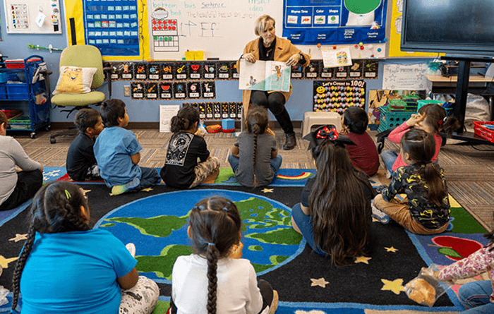 Teacher reading to students.